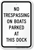 No Trespassing On Boats Parked At Dock Sign