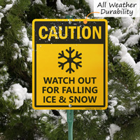 Watch out for falling snow sign with stake
