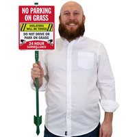 No Parking on Grass Sign: Violators Towed